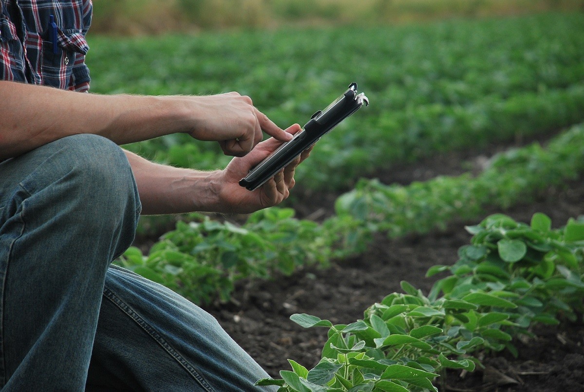 Eric (a farmer) is holding an iPad